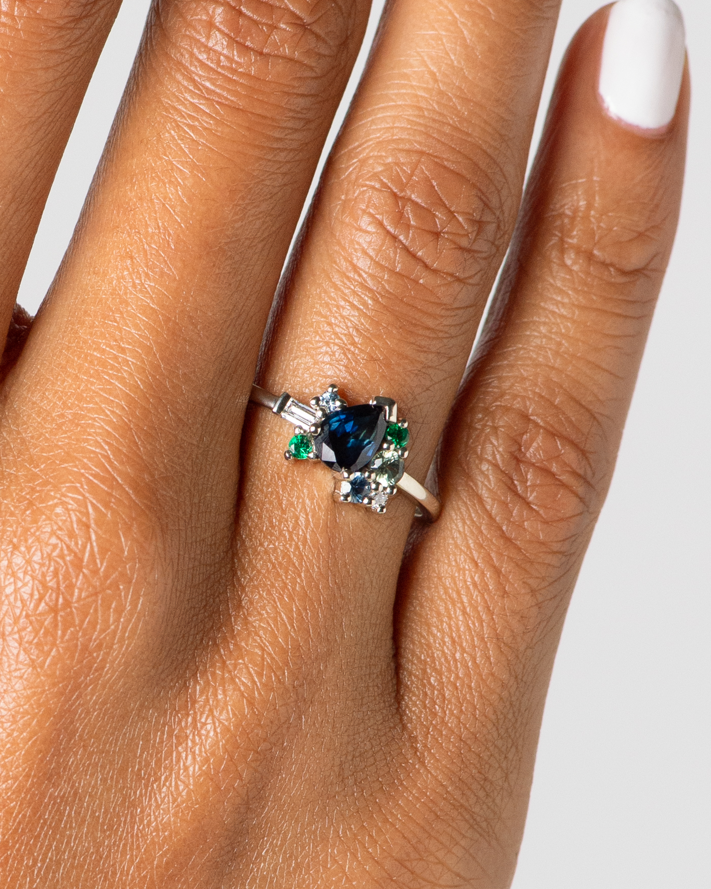CUST_Cluster_Pear_Blue_Sapphire_and_Emerald_Ring_14W_Torres_WEB2 (1)
